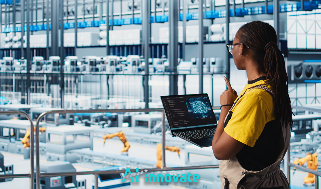A person holding a laptop monitors a high-tech automated factory floor with robotic arms and industrial equipment.